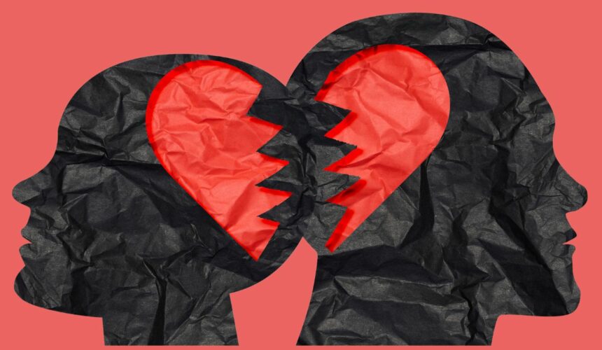 Deux profils humains séparés par un cœur brisé, illustrant la douleur d'un chagrin d'amour