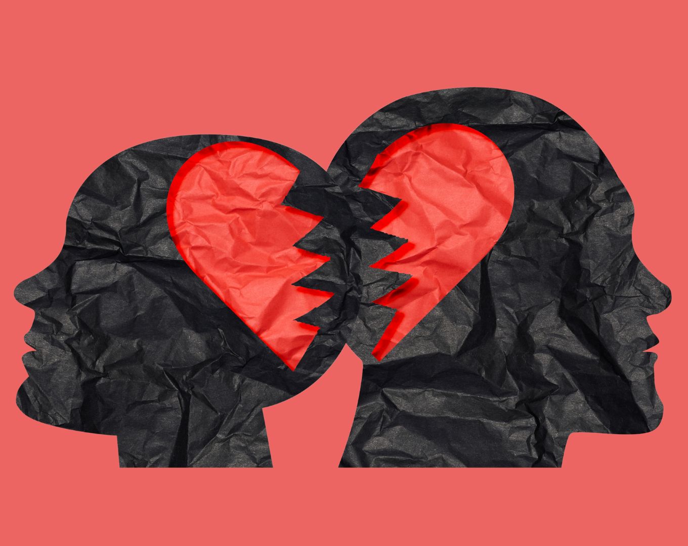 Deux profils humains séparés par un cœur brisé, illustrant la douleur d'un chagrin d'amour